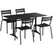 A black Lancaster Table & Seating outdoor dining set with four chairs on a table.