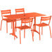 An orange Lancaster Table & Seating outdoor table and chairs set with an umbrella hole.