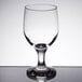 A close-up of a Libbey Embassy wine glass on a reflective surface.