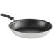 A Vollrath stainless steel frying pan with a black non-stick interior and black silicone handle.