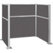 A Versare charcoal gray cubicle with silver metal posts.