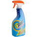 A blue SC Johnson Shout spray bottle with orange and rainbow accents.