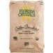 A brown Florida Crystals bag of granulated raw cane sugar with green text.