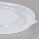 A translucent white plastic Cambro lid with text on it.