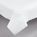 A white Hoffmaster Cellutex tablecloth with a folded edge on a table.