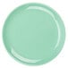 A close-up of a light green Tuxton Healthcare China plate.
