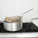 A Vollrath Wear-Ever aluminum fry pot with food in a basket.