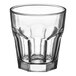 An Acopa Memphis clear glass with a curved rim.