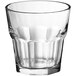 An Acopa Memphis clear glass rocks/old fashioned tumbler with a textured pattern.