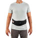 A man wearing an Ergodyne ProFlex 1505 black back support belt.