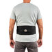 A man wearing a black Ergodyne ProFlex back support belt.