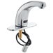 A close-up of a Waterloo chrome hands-free sensor faucet with a cable attached to it.
