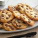A plate of Ghirardelli 72% non-dairy dark chocolate chip cookies.