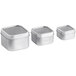 A group of 3 silver square metal tins with clear window lids.