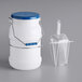A white polypropylene bucket with a blue lid, a polypropylene container, and a scoop.