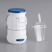 A white polypropylene container with a blue lid and a white handle.