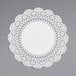 A white Hoffmaster Cambridge Lace doily on a gray surface.