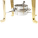 A Vollrath Classic Brass Coffee Urn with a metal pot on a table outdoors.