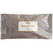 A close up of a Tommy Bahama soap bar in brown and white packaging.