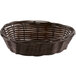 A close-up of a brown Tablecraft oval rattan basket with handles.