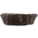 A Tablecraft brown oval rattan basket with handles.