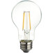 A TCP clear filament LED light bulb with a yellow filament.