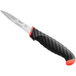 A Schraf serrated paring knife with a red handle.
