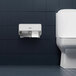 A white Kimberly-Clark Professional toilet paper dispenser with a white mosaic faceplate on the wall above a toilet.