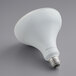 A TCP Elite dimmable LED light bulb with a white base and white dome on a gray surface.
