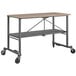 A Cosco portable folding workbench with wheels.