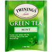 A green box of Twinings Green Tea with Mint Tea Bags with a leaf on the front.