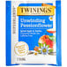 A blue and white box of Twinings Unwind Passionflower & Chamomile, Spiced Apple & Vanilla Herbal Tea Bags.