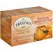 A box of Twinings Honeybush, Mandarin & Orange Herbal Tea with an orange on the front.