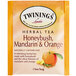 A box of Twinings Honeybush, Mandarin & Orange Herbal Tea Bags with orange and green packaging.