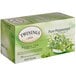 A box of Twinings Pure Peppermint Herbal Tea Bags with green leaves on it.