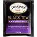 A box of Twinings Blackcurrant Breeze Tea Bags with black and purple packaging.