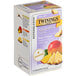 A box of Twinings Focus Ginseng, Mango & Pineapple Herbal Tea Bags with a label featuring pineapple and mango.