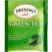A green Twinings tea box with a close-up of a green tea leaf.