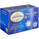 A blue box of Twinings Winter Spice Herbal Tea Bags with white text and snowflakes on it.