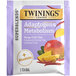 A purple and white box of Twinings Boost Adaptogens Mango Chili Chai Herbal Tea Bags with a picture of fruit.