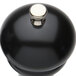 A Chef Specialties black pepper mill with a silver knob.