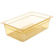 A Carlisle amber plastic food pan with a clear lid on it.
