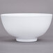 A close-up of a white GET Water Lily melamine bowl.