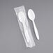 Two Visions white plastic spoons in plastic packaging.