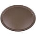 A brown oval Carlisle Griptite non skid fiberglass serving tray.