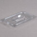 A Carlisle clear plastic 1/4 size food pan lid with a handle.