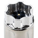 A Hamilton Beach stainless steel container with a black lid.