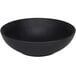 A black Cal-Mil Sedona coupe melamine bowl with a textured surface.