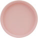 A close-up of a pink Cal-Mil melamine plate with a low rim.