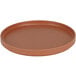 A round brown Cal-Mil Hudson Terra Cotta melamine plate with a low rim.